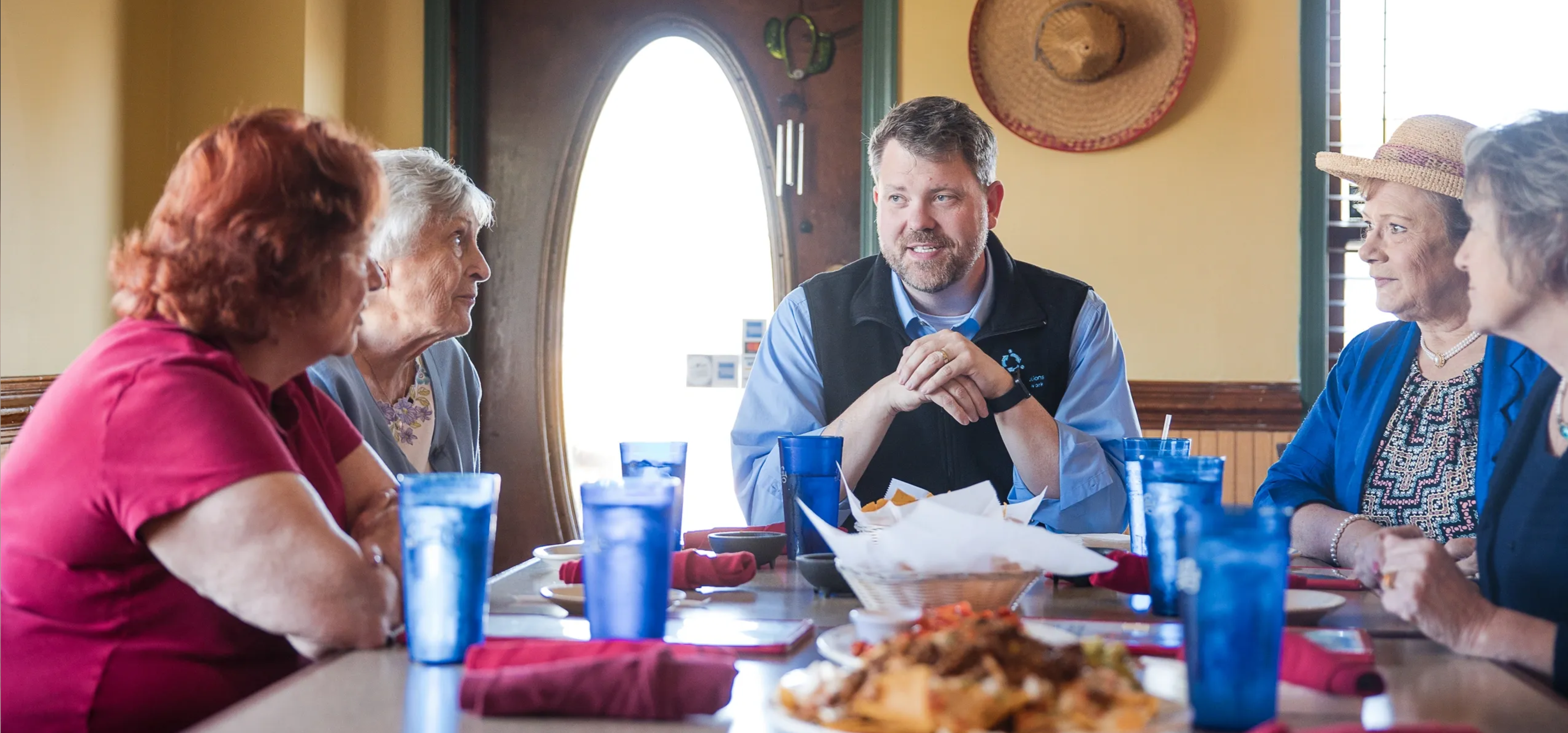 Ian Lovejoy sits at a table with future constituents.